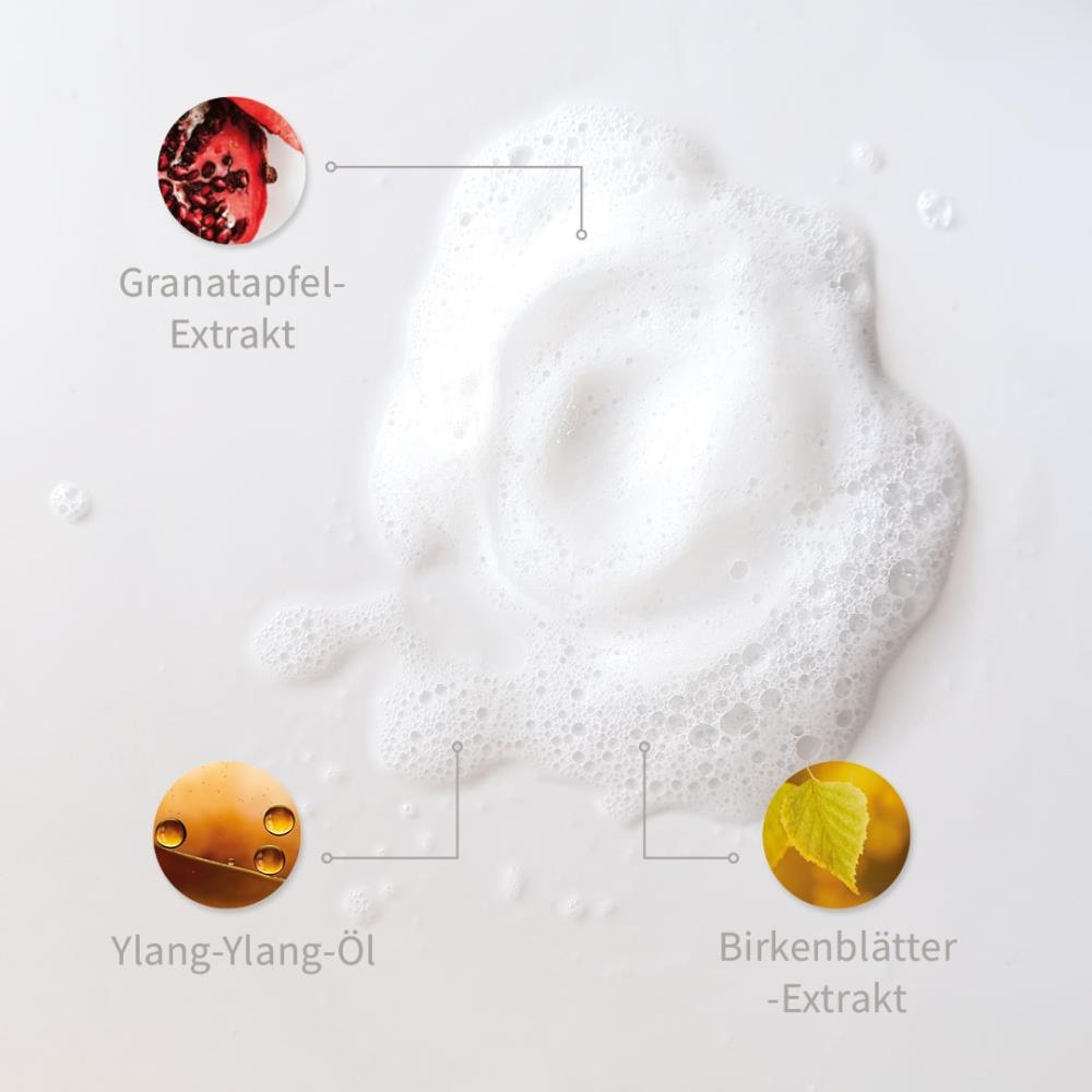 Weiße Schaum-Textur mit markierten Inhaltsstoffen: Granatapfel-Extrakt, Ylang-Yang-Öl, Birkenblätter-Extrakt